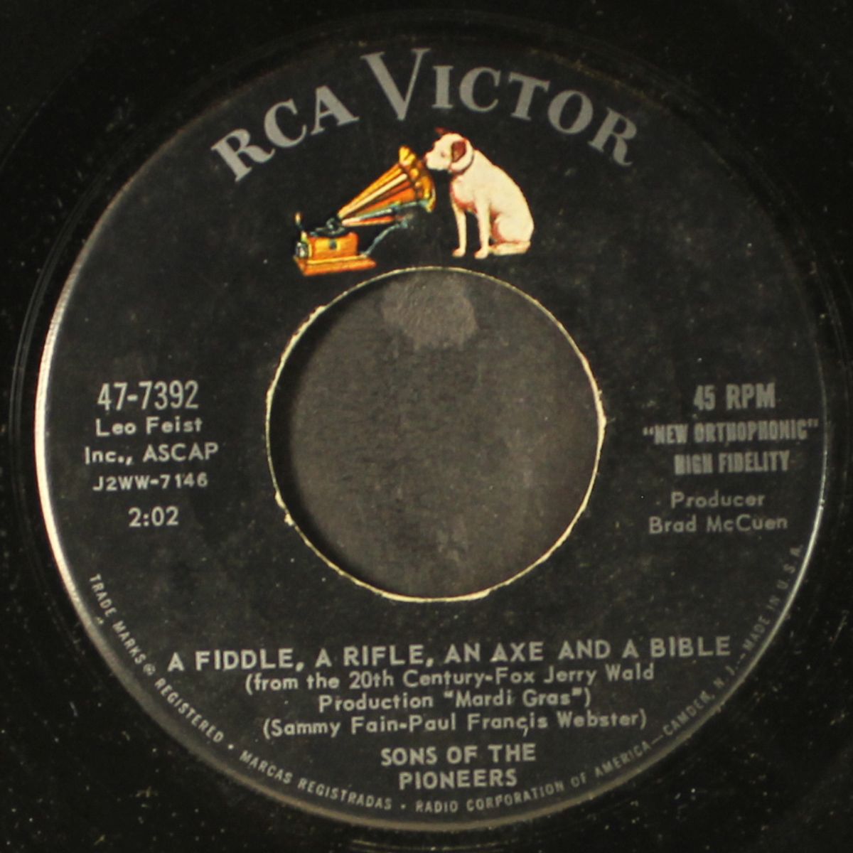 a fiddle, a rifle, an axe and a bible by SONS OF THE PIONEERS