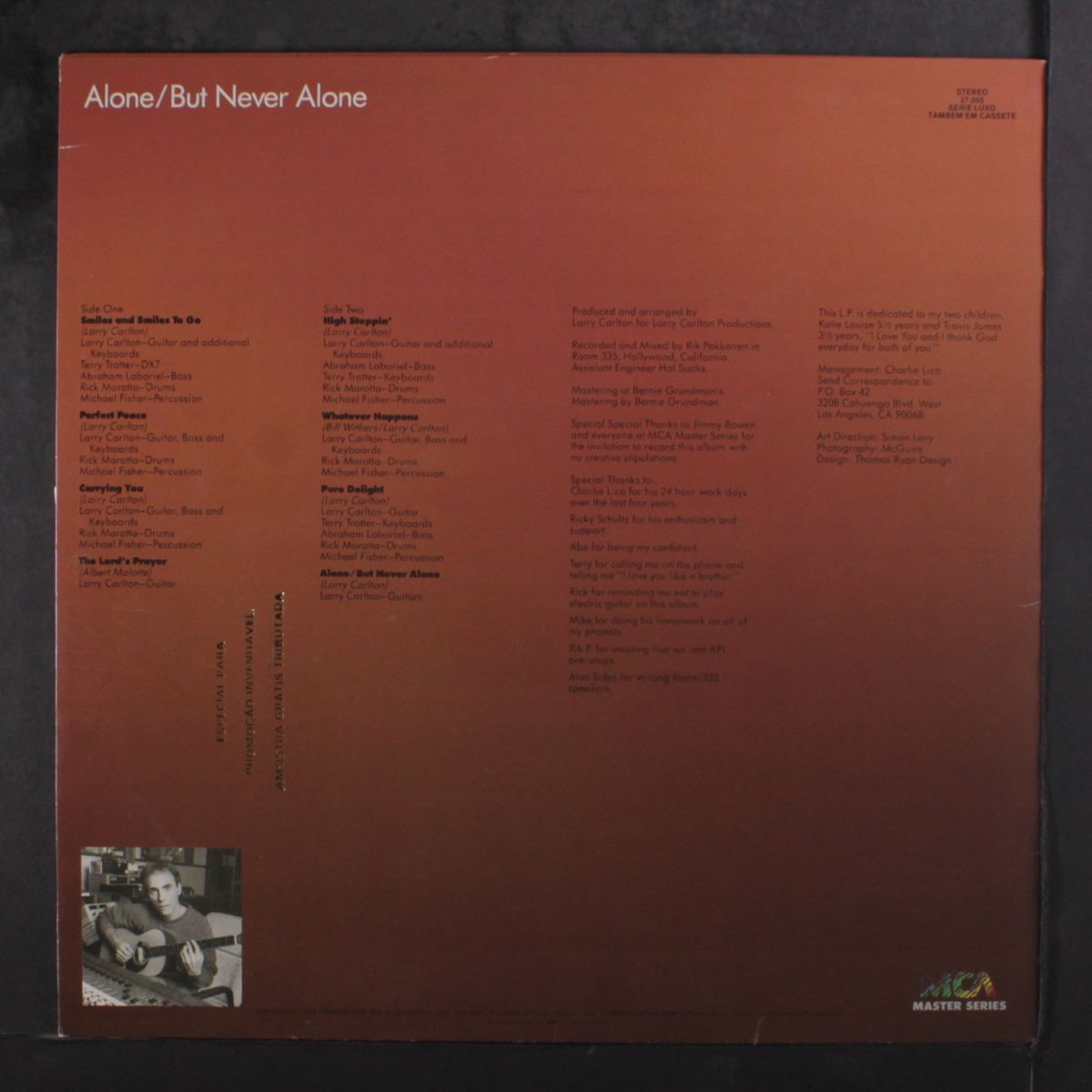 alone / but never alone by LARRY CARLTON