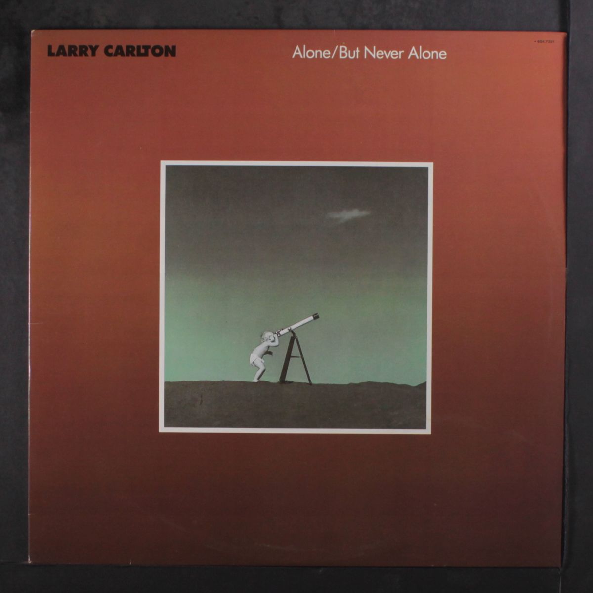 alone / but never alone by LARRY CARLTON