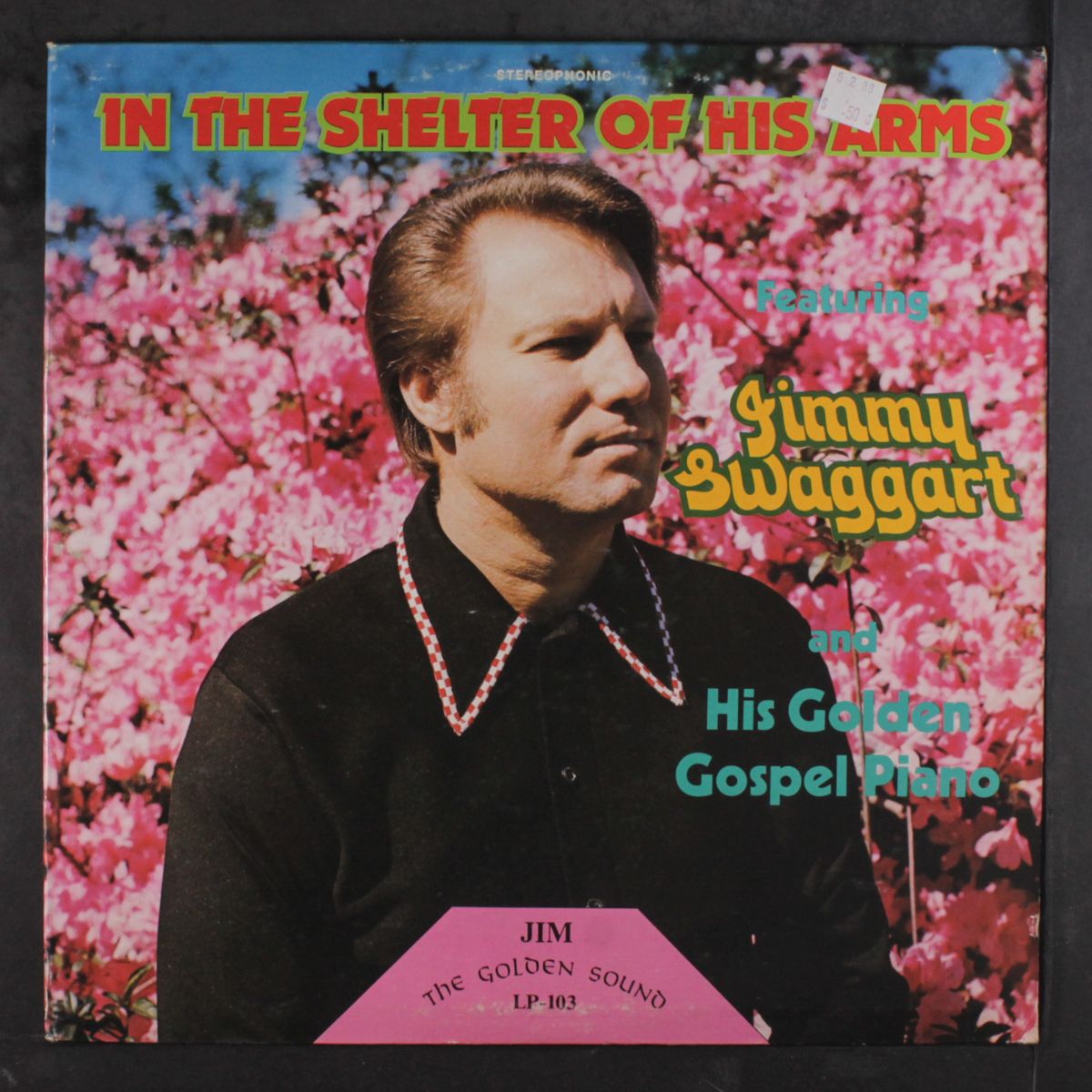 in the shelter of his arms by JIMMY SWAGGART