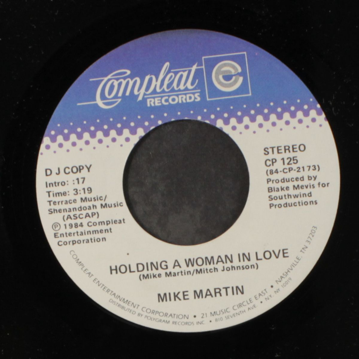 holding a woman in love by MIKE MARTIN