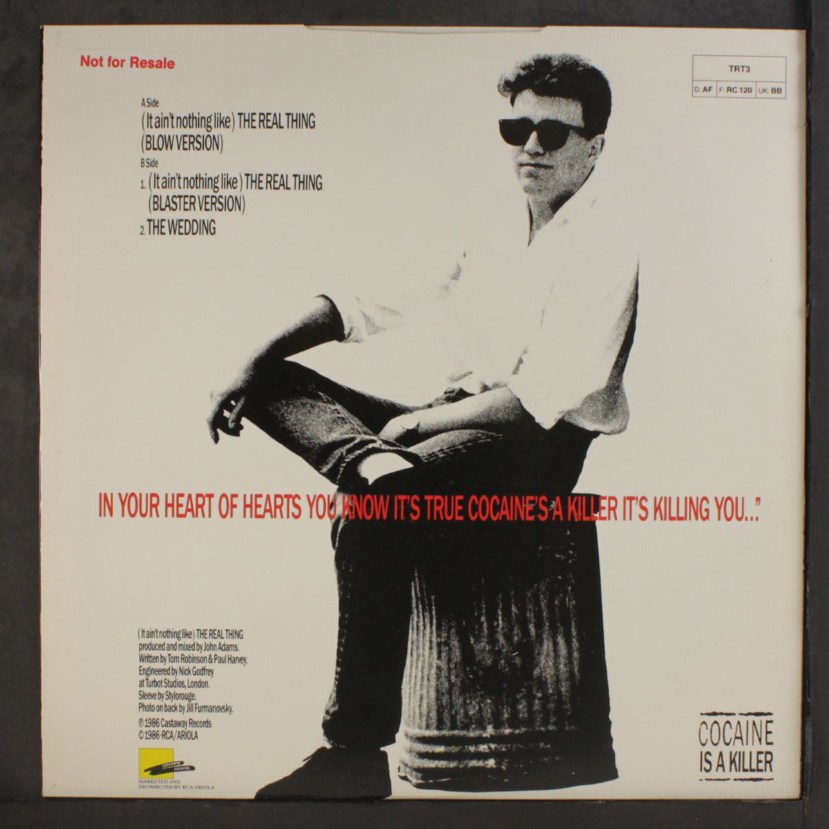 (it ain't nothing like the real thing) by TOM ROBINSON