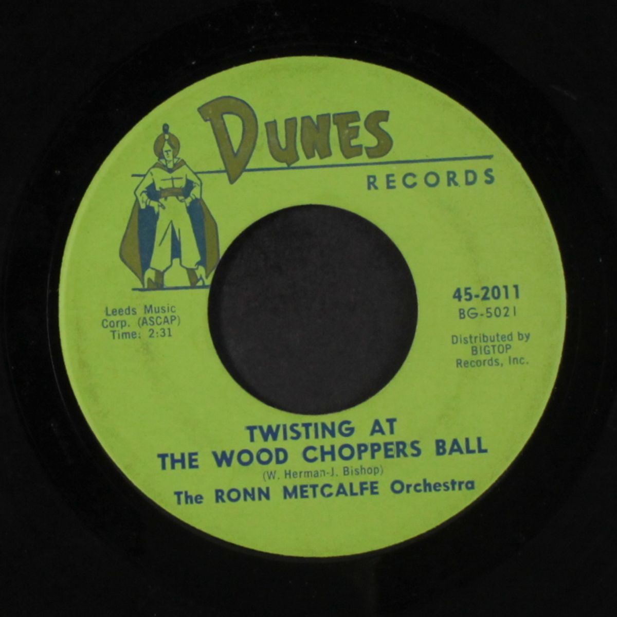 twisting at the wood chopper's ball by RONN METCALFE
