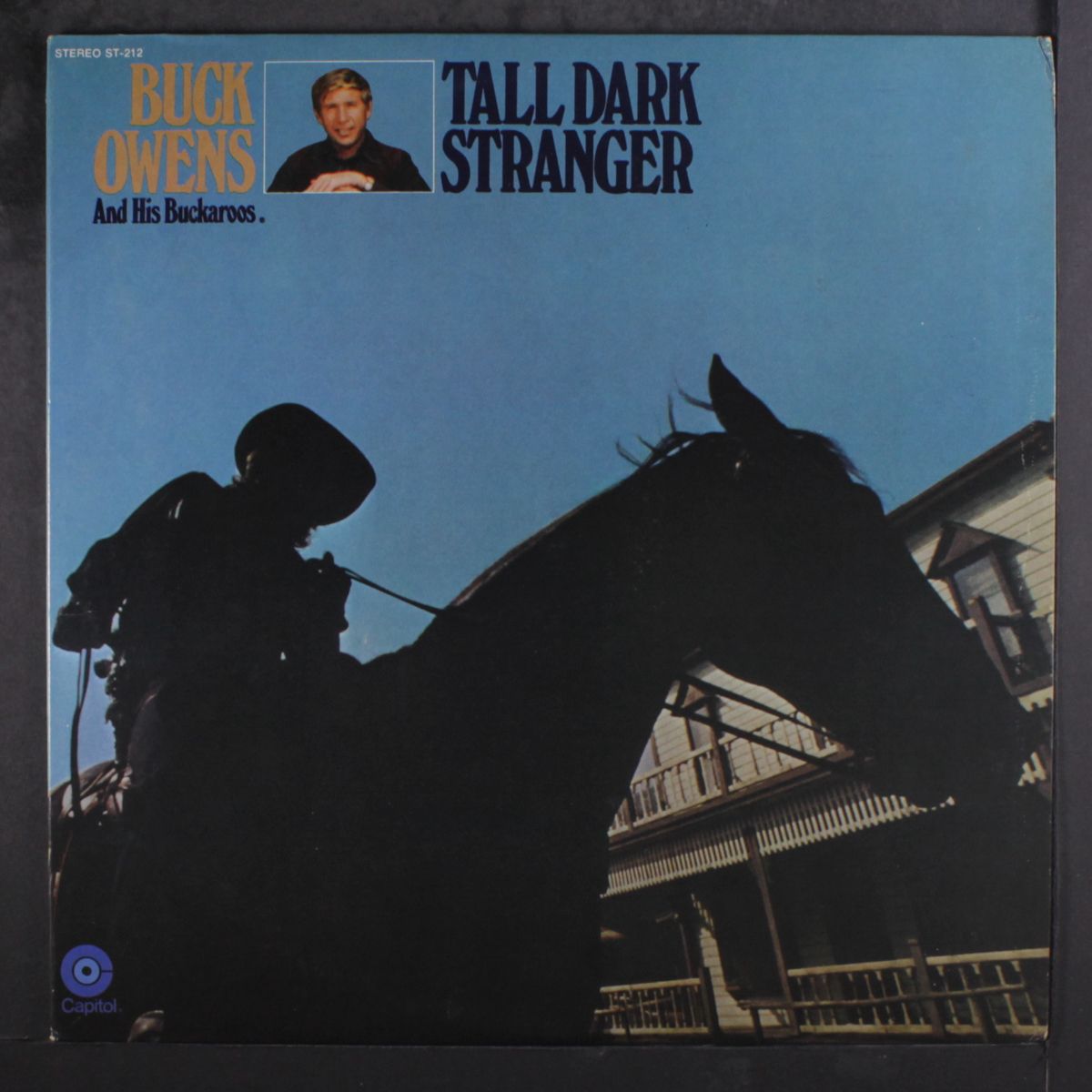 tall dark stranger by BUCK OWENS